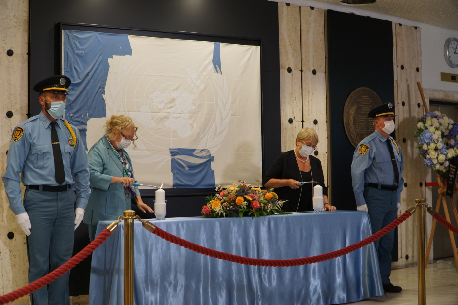 UN Geneva Director-General Tatiana Valovaya and Human Rights Chief Michelle Bachelet light candles at the ceremony for World Humanitarian Day 2021 in Geneva.