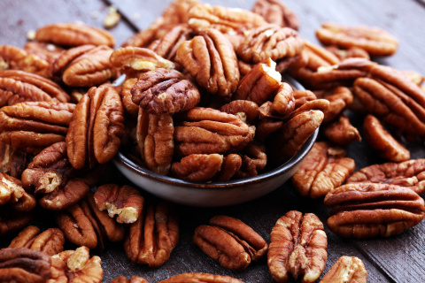 A table full of pecan nuts. 