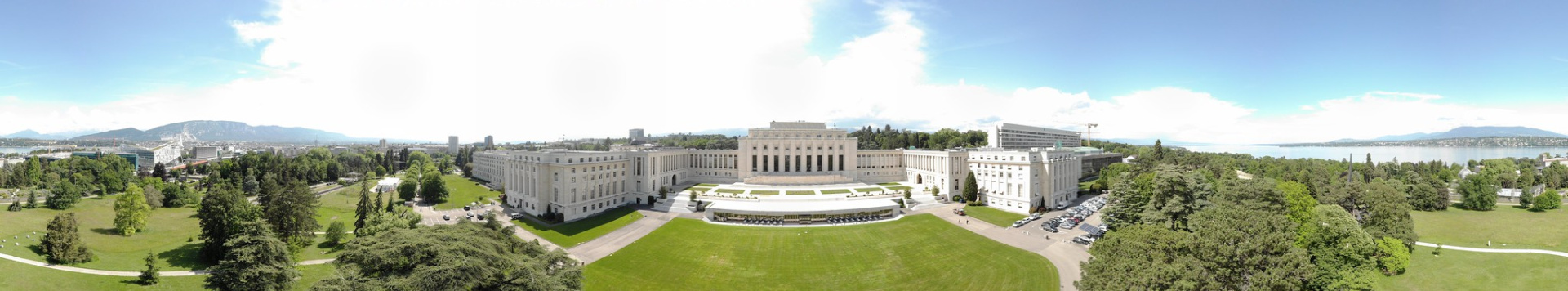 A view from above of the main building and the lush lawns of the Palais des Nations.
